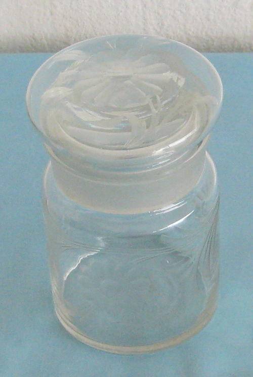 LIDDED GLASS JAR WITH INTRICATE FLOWER DESIGN