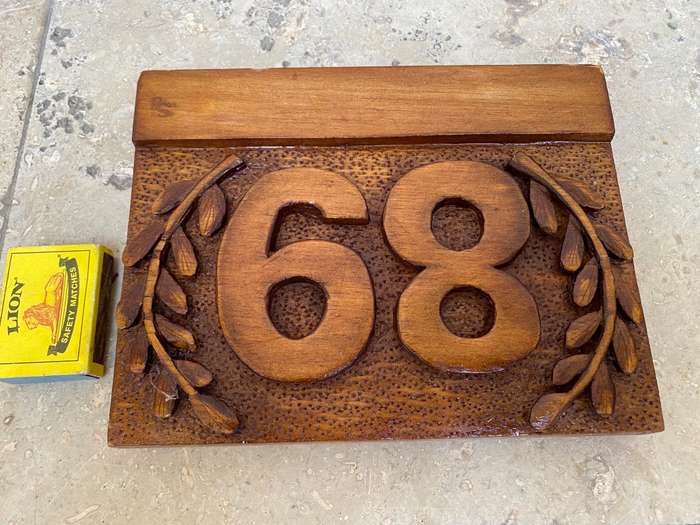 No 89 , no 68 wood carved no plaque