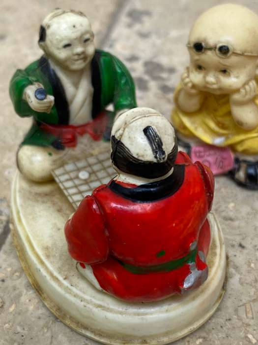 Vintage celluloid Japan miniature scene elders playing with resin baby Buddha