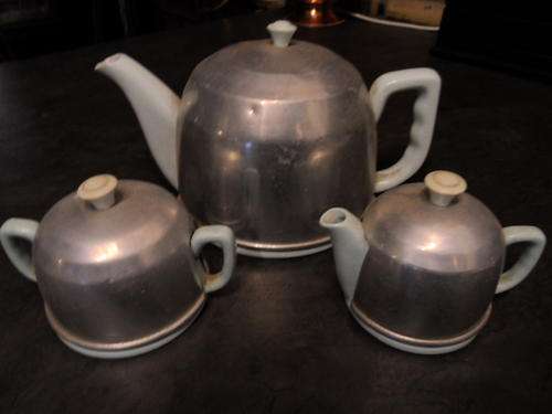 VERY OLD TEAPOT AND SUGAR BASIN AND MILK JUG WITH COVERS NOTE CRACKED EAR