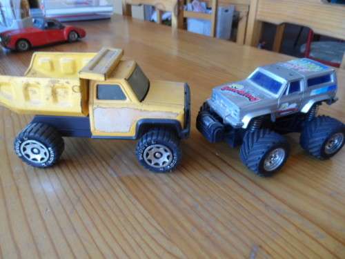 BUDDY L PRESSED METAL TIP TRUCK AND PLASTIC MONSTER TRUCK