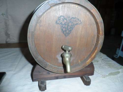 Very large oak wine barrel for a pub on a stand.    26.5 long 20cm diameter  brass tap and bands