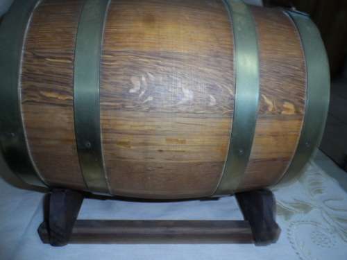 Very large oak wine barrel for a pub on a stand.    26.5 long 20cm diameter  brass tap and bands