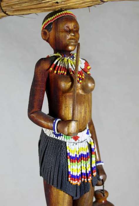 HR Mbhele - Woman Carrying Large Bundle of Reeds