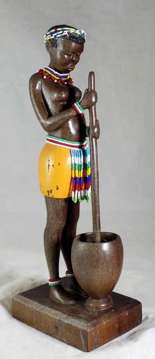 HR Mbhele - Woman Stamping food in Container
