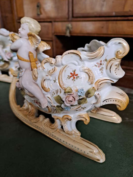 Fabulous Pair of vintage German bisque cherubs on sleighs center piece