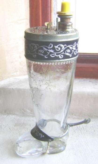 VINTAGE MUSICAL BOOT AND SPUR TOT MEASURE BOTTLE