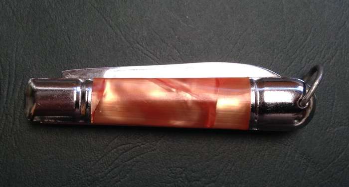 Pocket knife, crossed arrows mark.