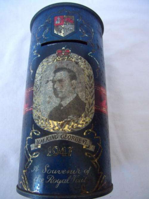 A ROYAL MONEY BOX - A SOUVENIR OF THE ROYAL VISIT OF H.M. KING GEORGE V1 AND H.M. QUEEN ELIZABETH IN