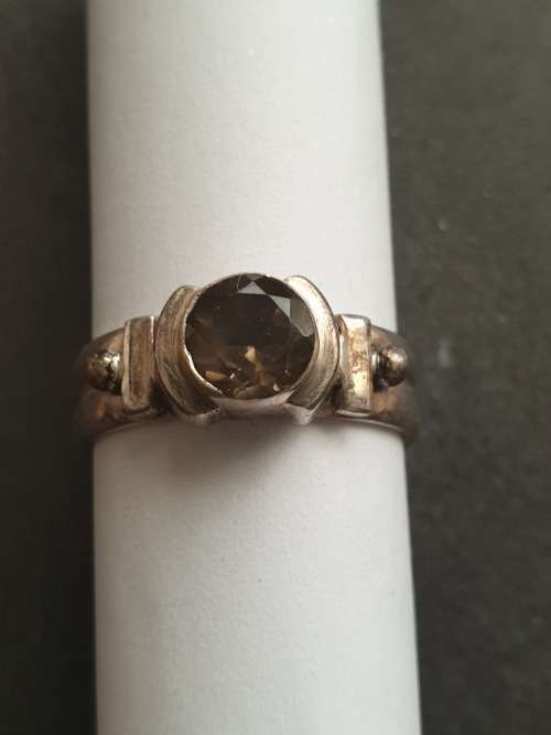 silver ring with a smokey stones stamp 926