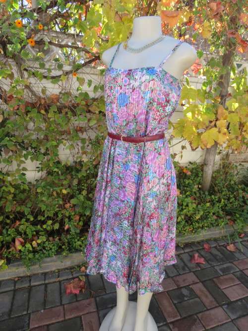 Summer strappy dress in array of spring flowers.Made by owner.Size 38/14.Fine condition.