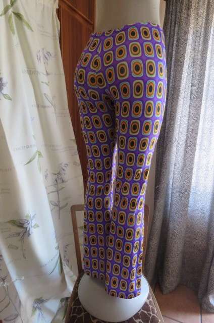 Eyecatching bootlegged polyester stretch pants size 34 to 36 in purple with orange, black+turquoise