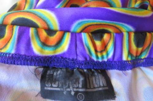 Eyecatching bootlegged polyester stretch pants size 34 to 36 in purple with orange, black+turquoise