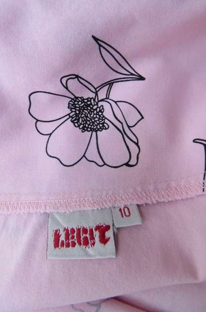 Lovely coral colour wide A-line skirt with black flowers.Yoked waist size 34/10 by `Legit`. As new.