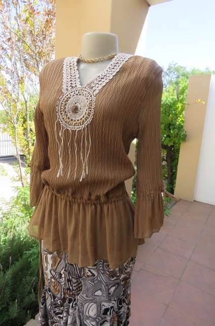 Fab light brown peplum style top in pattern creased 100% wash and wear polyester fabric.Size 36/12