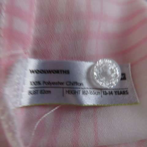 Soft and silky white and pink check long sleeve blouse in 100% polyester chiffon. Size 30 As new