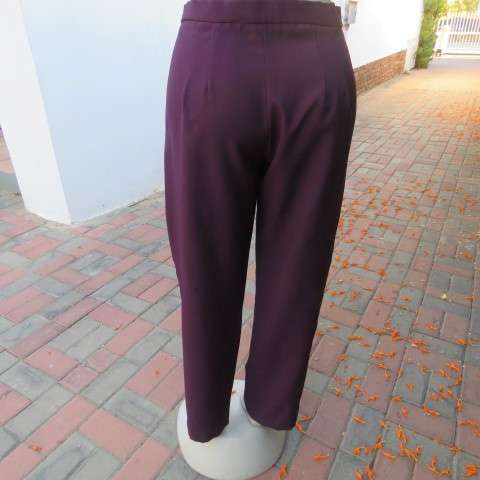 Smart dark plum colour dress pants. Zip on front size 40/16. Legs a bit tapered. As new.