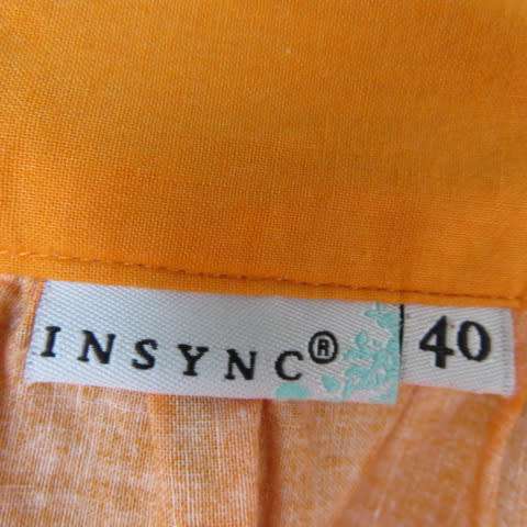Cheerful yoked skirt in orange with gathered wide bottom size 40/16. Sequined border.New condition.