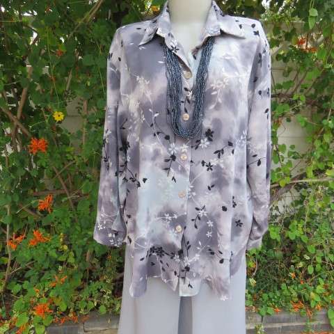 Silver and darker grey coloured long sleeve top with black and white floral pattern, Size 42/18