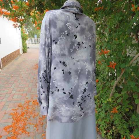 Silver and darker grey coloured long sleeve top with black and white floral pattern, Size 42/18