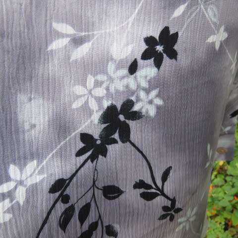 Silver and darker grey coloured long sleeve top with black and white floral pattern, Size 42/18