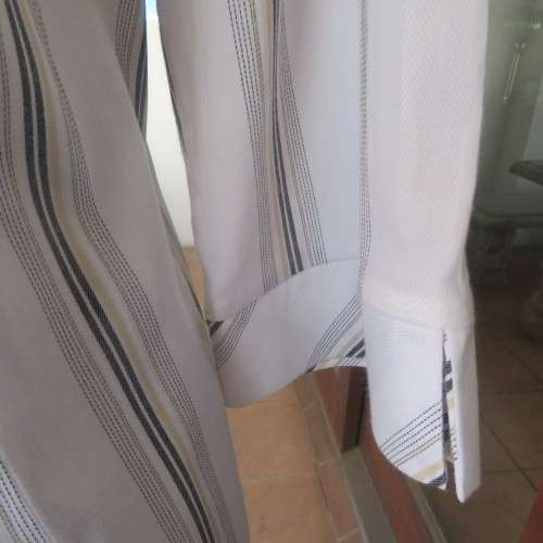 White extra long top with brown,mustard and white embossed vertical stripes. Size 42/18 by PRIMA.