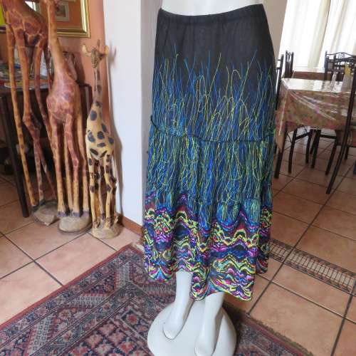 Eyecatching tiered skirt. Ankle length in sheer polyester. Size 40/16 by FASHION EXPRESS. As new.