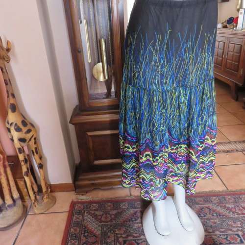 Eyecatching tiered skirt. Ankle length in sheer polyester. Size 40/16 by FASHION EXPRESS. As new.