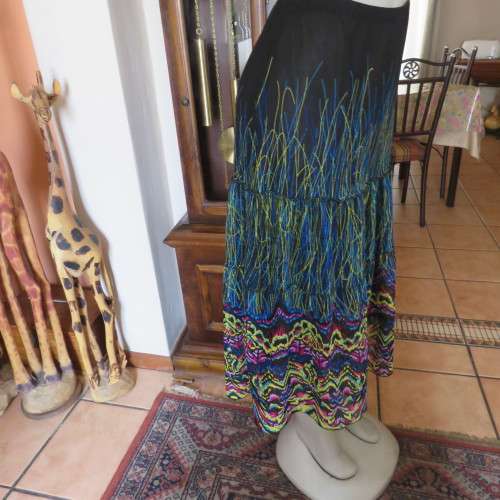 Eyecatching tiered skirt. Ankle length in sheer polyester. Size 40/16 by FASHION EXPRESS. As new.