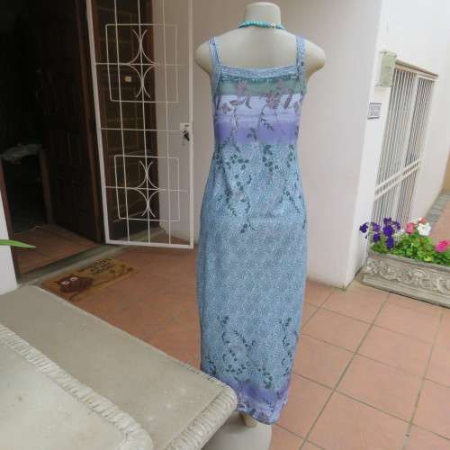 Beautiful summer shift dress with shoulder straps. Border across bust and seam. Size 34/10. As new.