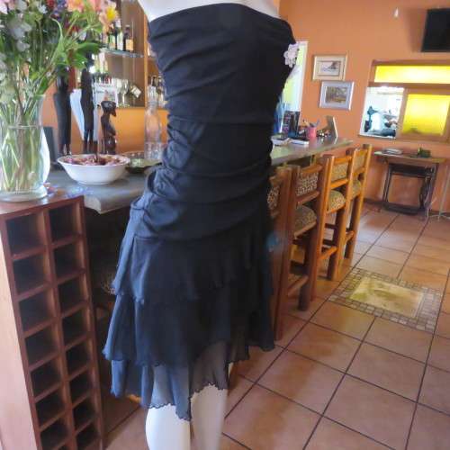 Little black dress with frilled bottom and ruched strapless top. Size 34/10 By `Jin Taiyang`. As new