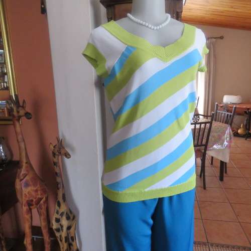 Cute viscose/nylon knit slip over top with diagonal stripes in blue,white and limegreen. Size 34/10.