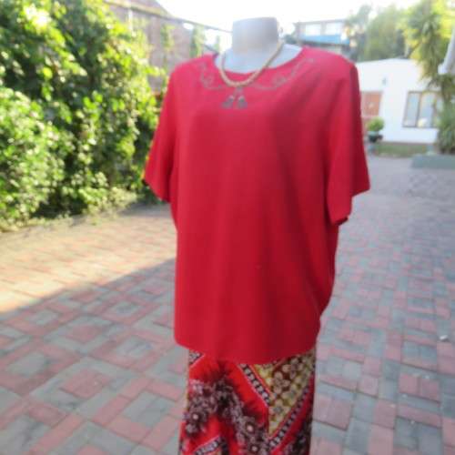 Cherry red slip over silky 100% polyester short sleeve top with stunning embroidery.Size 48.As new