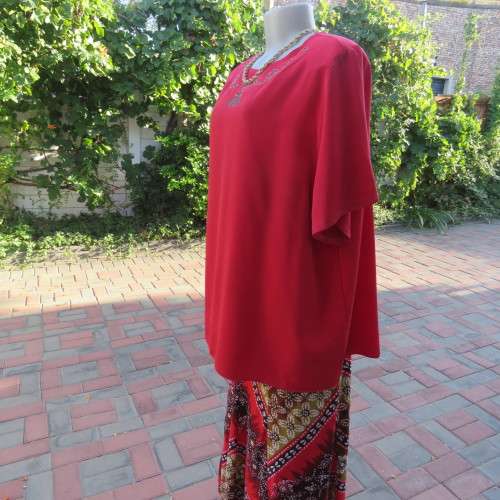 Cherry red slip over silky 100% polyester short sleeve top with stunning embroidery.Size 48.As new