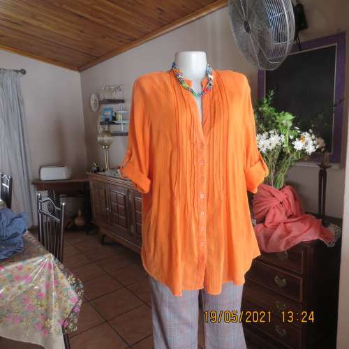 Eyecatching tangerine 100% cotton button down top with tucked decoration.By DONATELLA size 46/22