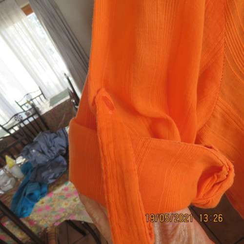 Eyecatching tangerine 100% cotton button down top with tucked decoration.By DONATELLA size 46/22