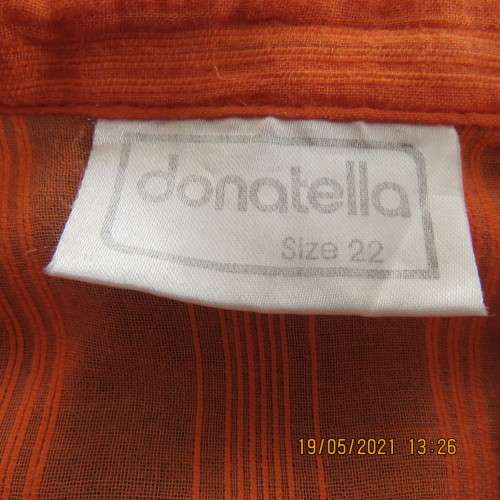 Eyecatching tangerine 100% cotton button down top with tucked decoration.By DONATELLA size 46/22
