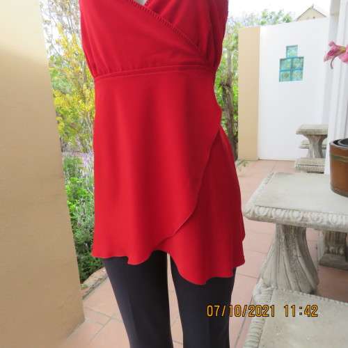 As new race red embellished evening top. Crossover bust and front. Size 38/14.Satin polyester.