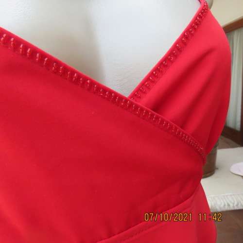 As new race red embellished evening top. Crossover bust and front. Size 38/14.Satin polyester.