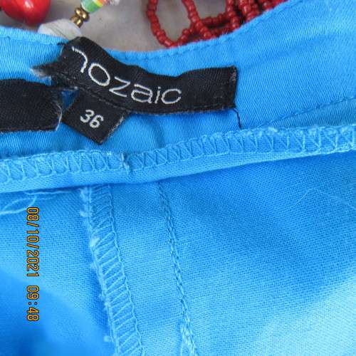 Skinny legged cerulean blue pants with side pockets and dummies at back.Stretch cotton. Size 36/12