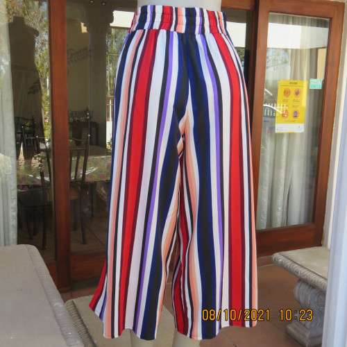 Eyecatching elongating ankle pants.Wide colourful vertical stripes.Red,purple,peach ext.Size 42/18