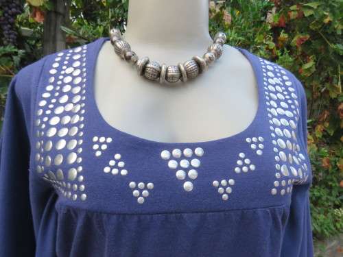 Must have navy cropped polycotton top with wide low bell sleeves. Studs on yoke front.Size 34/10.