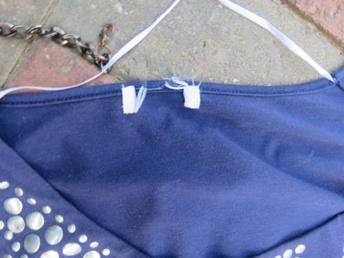 Must have navy cropped polycotton top with wide low bell sleeves. Studs on yoke front.Size 34/10.