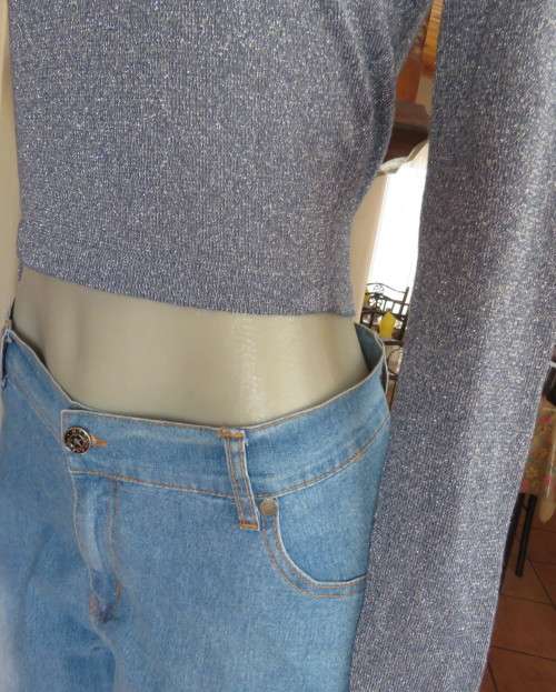 Tiffany blue glitter cropped top in stretch viscose and lurex.Slip over with long sleeves.Size 30