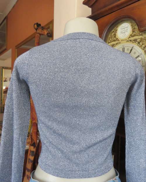 Tiffany blue glitter cropped top in stretch viscose and lurex.Slip over with long sleeves.Size 30