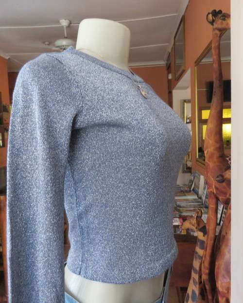 Tiffany blue glitter cropped top in stretch viscose and lurex.Slip over with long sleeves.Size 30