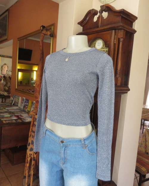 Tiffany blue glitter cropped top in stretch viscose and lurex.Slip over with long sleeves.Size 30
