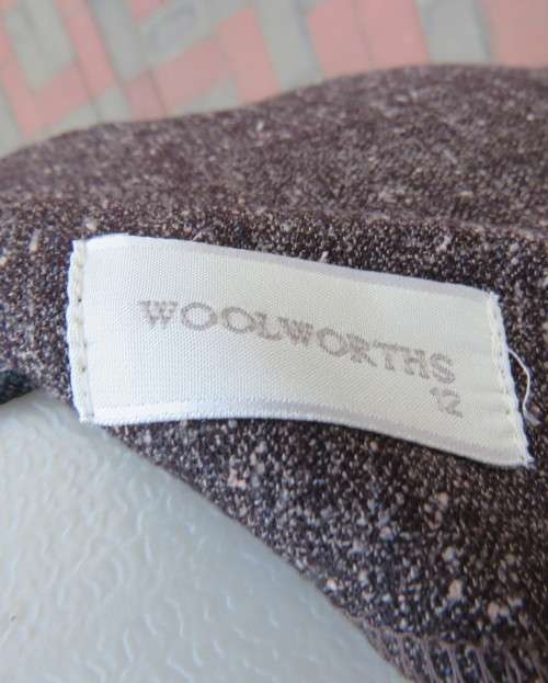 Slim down your bottom half with this mottled brown A-line front paneled Skirt.Size 36 by WOOLWORTHS