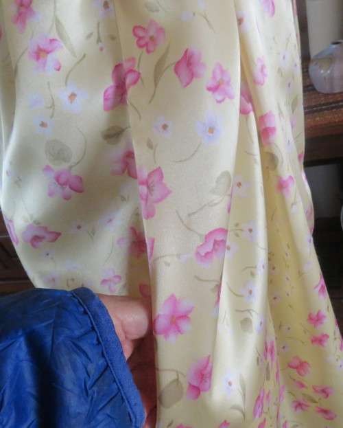 As new vanilla yellow silkyfold over night gown with pink/white flowers.Tiny cut-on sleeves.Size 42