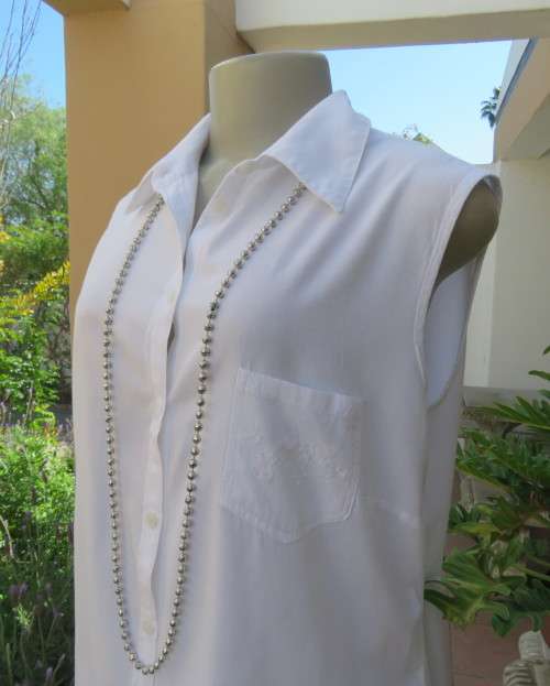 Snow white sleeveless summer top.Button down with shirt collar.By WOOLWORTHS size 38/14.As new.
